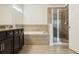 Bathroom with double vanity, soaking tub, and separate shower at 611 Marsh Reed Dr, Winter Garden, FL 34787