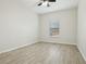 Bedroom with wood-look tile flooring and ceiling fan at 611 Marsh Reed Dr, Winter Garden, FL 34787