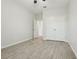 Bedroom with wood-look tile flooring and double doors at 611 Marsh Reed Dr, Winter Garden, FL 34787