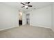 Bright bedroom featuring carpet, ceiling fan and en-suite bathroom at 611 Marsh Reed Dr, Winter Garden, FL 34787