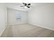 Bright bedroom with ceiling fan and window at 611 Marsh Reed Dr, Winter Garden, FL 34787