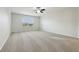 Spacious bedroom with window and ceiling fan at 611 Marsh Reed Dr, Winter Garden, FL 34787