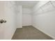 Large walk-in closet with wire shelving and carpeting at 611 Marsh Reed Dr, Winter Garden, FL 34787