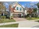 Two-story house with brown brick driveway and landscaping at 611 Marsh Reed Dr, Winter Garden, FL 34787