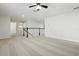 Open loft area with carpeted floor and ceiling fan at 611 Marsh Reed Dr, Winter Garden, FL 34787