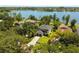 Beautiful aerial view showcasing a well-maintained property with lush greenery and lake access, highlighting the desirable location at 6564 Lagoon St, Windermere, FL 34786