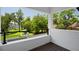 Beautiful outdoor balcony overlooking lush backyard with pool and lake view at 6564 Lagoon St, Windermere, FL 34786