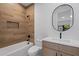 Beautiful bathroom featuring wood-look tile, soaking tub, and a modern vanity at 6564 Lagoon St, Windermere, FL 34786