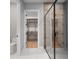 Modern bathroom featuring a sleek glass shower and doorway to walk-in closet at 6564 Lagoon St, Windermere, FL 34786
