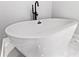 Modern freestanding soaking tub in a corner at 6564 Lagoon St, Windermere, FL 34786