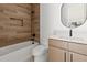 Modern bathroom with wood-look tile and updated fixtures at 6564 Lagoon St, Windermere, FL 34786