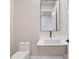 Stylish powder room with a square vessel sink, modern faucet, and elegant finishes at 6564 Lagoon St, Windermere, FL 34786