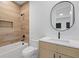 Beautiful bathroom featuring wood-look tile, soaking tub, and a modern vanity at 6564 Lagoon St, Windermere, FL 34786