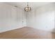 Spacious bedroom with light hardwood floors and chandelier at 6564 Lagoon St, Windermere, FL 34786