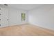 Bright, vacant bedroom with hardwood floors, white trim, and window at 6564 Lagoon St, Windermere, FL 34786