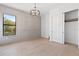 Bedroom with hardwood floors, chandelier, and closet at 6564 Lagoon St, Windermere, FL 34786