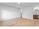 Light-filled bedroom with wood floors and ensuite bathroom at 6564 Lagoon St, Windermere, FL 34786