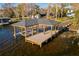 Spacious covered boat dock with ample deck space at 6564 Lagoon St, Windermere, FL 34786