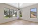 Modern dining room featuring hardwood floors and water views at 6564 Lagoon St, Windermere, FL 34786