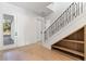 Light and bright entryway with stairs and built-in shelving at 6564 Lagoon St, Windermere, FL 34786