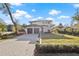 Two-story home with a modern design, two-car garage, and landscaped yard at 6564 Lagoon St, Windermere, FL 34786