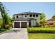 Beautiful two-story home with a well-manicured lawn and a two-car garage at 6564 Lagoon St, Windermere, FL 34786
