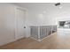 Upper hallway with light hardwood floors and modern railing at 6564 Lagoon St, Windermere, FL 34786