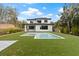 Modern two-story home with pool and lush landscaping at 6564 Lagoon St, Windermere, FL 34786