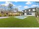 Modern two-story home with a turf lawn and pool at 6564 Lagoon St, Windermere, FL 34786