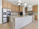 Modern kitchen with light wood cabinets and expansive marble island at 6564 Lagoon St, Windermere, FL 34786