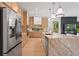 Contemporary kitchen featuring a large island, stainless steel appliances, and sleek countertops at 6564 Lagoon St, Windermere, FL 34786