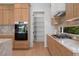 Well-equipped kitchen featuring modern appliances, spacious cabinetry, and a convenient pantry at 6564 Lagoon St, Windermere, FL 34786