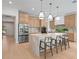 Elegant kitchen with a marble island, stainless steel appliances, and light wood cabinetry at 6564 Lagoon St, Windermere, FL 34786