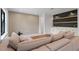 Comfortable living room with a large couch and a stylish accent wall with floating shelves at 6564 Lagoon St, Windermere, FL 34786