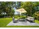 Outdoor living space with sleek furniture, perfect for relaxing with waterfront views at 6564 Lagoon St, Windermere, FL 34786