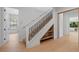 Elegant staircase with iron railings and built-in shelving at 6564 Lagoon St, Windermere, FL 34786