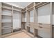 Bright walk-in closet with custom shelving and drawers for maximum organization at 6564 Lagoon St, Windermere, FL 34786
