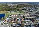 Aerial view of townhouses with pool, near lake and other homes at 7415 Lago De Oro # 2, Orlando, FL 32822