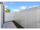 Private backyard with a white vinyl fence at 7415 Lago De Oro # 2, Orlando, FL 32822