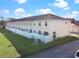 Tan building exterior, featuring multiple units at 7415 Lago De Oro # 2, Orlando, FL 32822