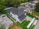 Aerial view of the home showing the backyard, white fence and surrounding neighborhood at 809 Maxwell St, Orlando, FL 32804