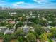 Aerial view of home in a neighborhood near a lake and with city skyline in the distance at 809 Maxwell St, Orlando, FL 32804