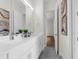 Bright bathroom with double vanity, stylish fixtures, and neutral color palette offering a serene and modern aesthetic at 809 Maxwell St, Orlando, FL 32804