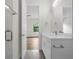 Bright bathroom with modern vanity, stylish fixtures, and a glimpse into a bedroom at 809 Maxwell St, Orlando, FL 32804
