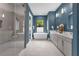 A serene bathroom showcases double vanities and a modern tub, all complemented by stylish fixtures at 809 Maxwell St, Orlando, FL 32804