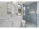 Modern bathroom featuring a glass-enclosed shower, vanity with ample storage, and contemporary finishes at 809 Maxwell St, Orlando, FL 32804