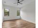 Bright bedroom with hardwood floors, large windows, and ceiling fan, creating a serene and inviting space at 809 Maxwell St, Orlando, FL 32804