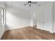 Bedroom features hardwood floors, ceiling fan, and ensuite bathroom entrance at 809 Maxwell St, Orlando, FL 32804