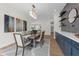 Inviting dining room with stylish light fixture, bar area, and open layout at 809 Maxwell St, Orlando, FL 32804