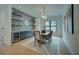 Stunning dining room boasts stylish lighting, blue accent wall with a buffet and shelving at 809 Maxwell St, Orlando, FL 32804